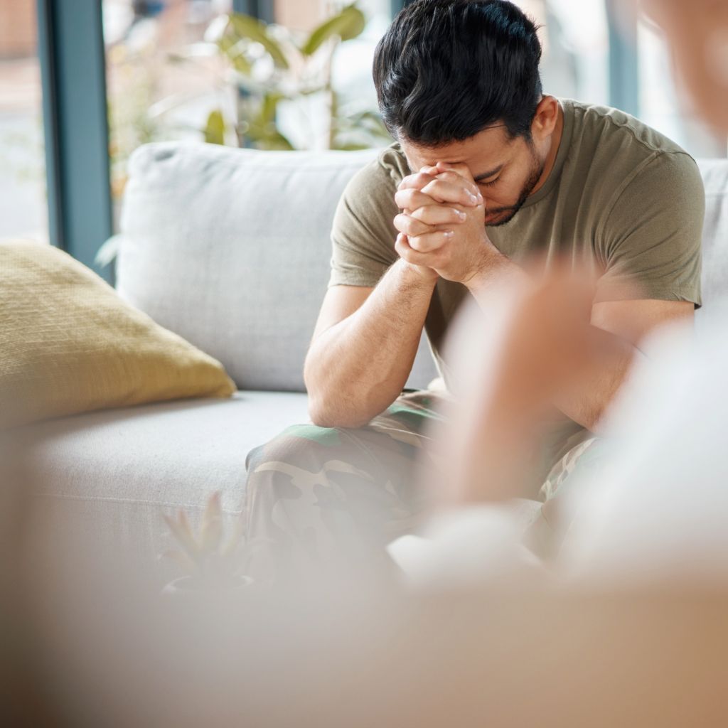 counselor view of an anxious and depressed man in therapy